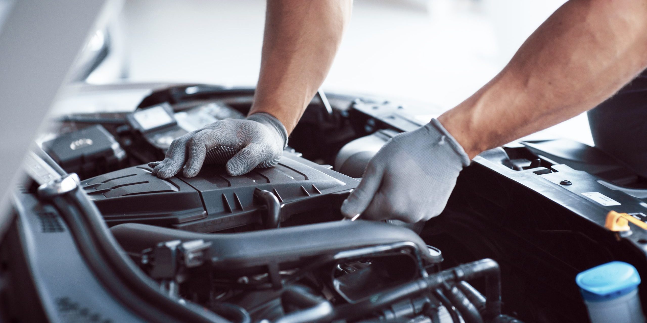 Auto mechanic working in garage. Repair service